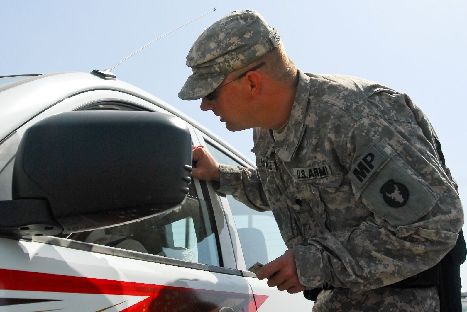 Military police patrol on duty enforcing law and order
